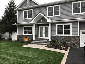 boulder creek faststak lasino fast stak cultured stone under window bluestone coping cap stoop steps walkway asphalt driveway colonial